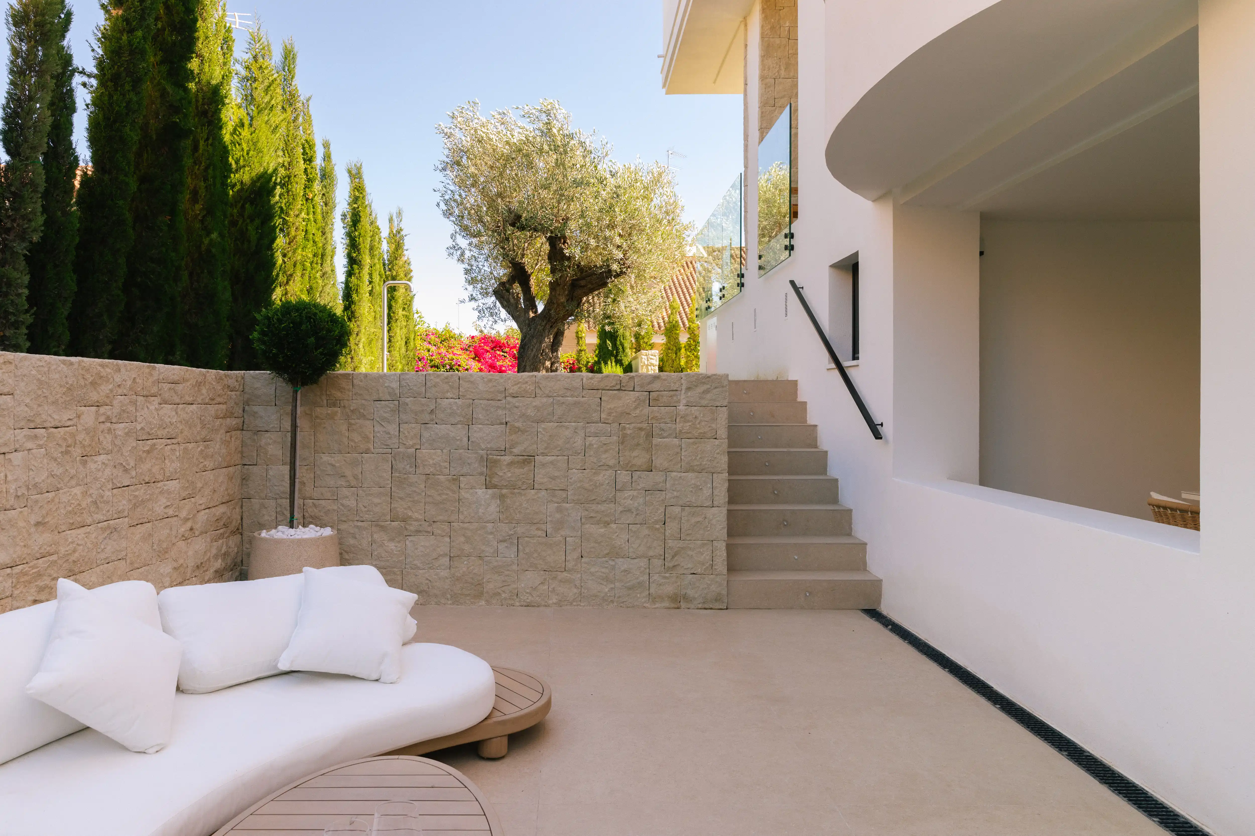 Outdoor terrace and pool area after ремонт виллы in Campolivar Валенсия image 75
