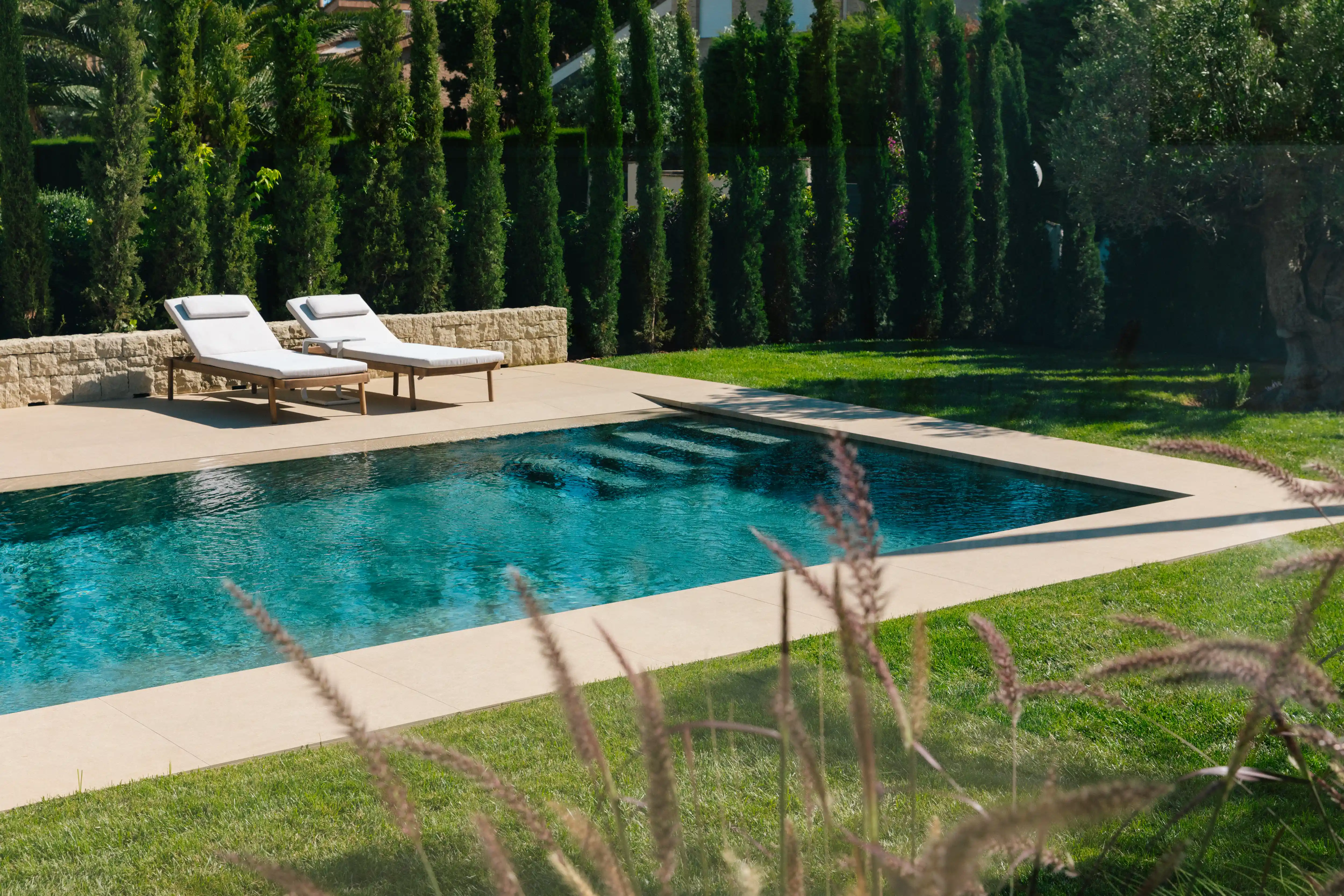 Outdoor terrace and pool area after ремонт виллы in Campolivar Валенсия image 76