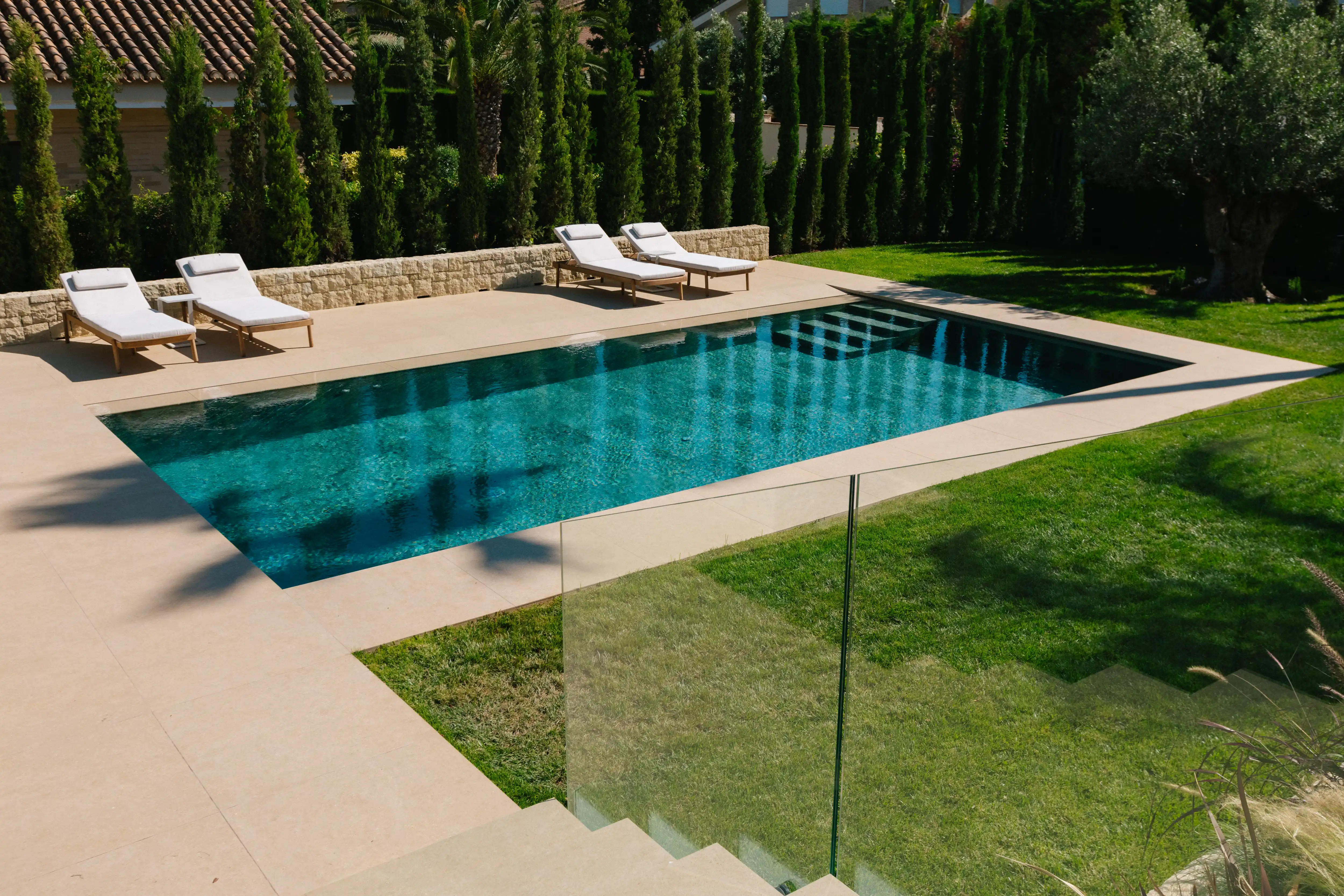 Outdoor terrace and pool area after ремонт виллы in Campolivar Валенсия image 78